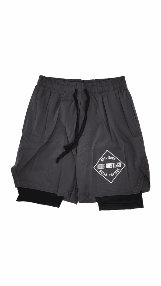 2 in 1 Compression Shorts, grey nylon, and compression shorts with an embroidered logo for active individuals with side hustles. comfortable and stylish hustle apparel.